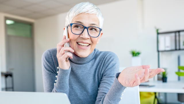 Woman in office on phone